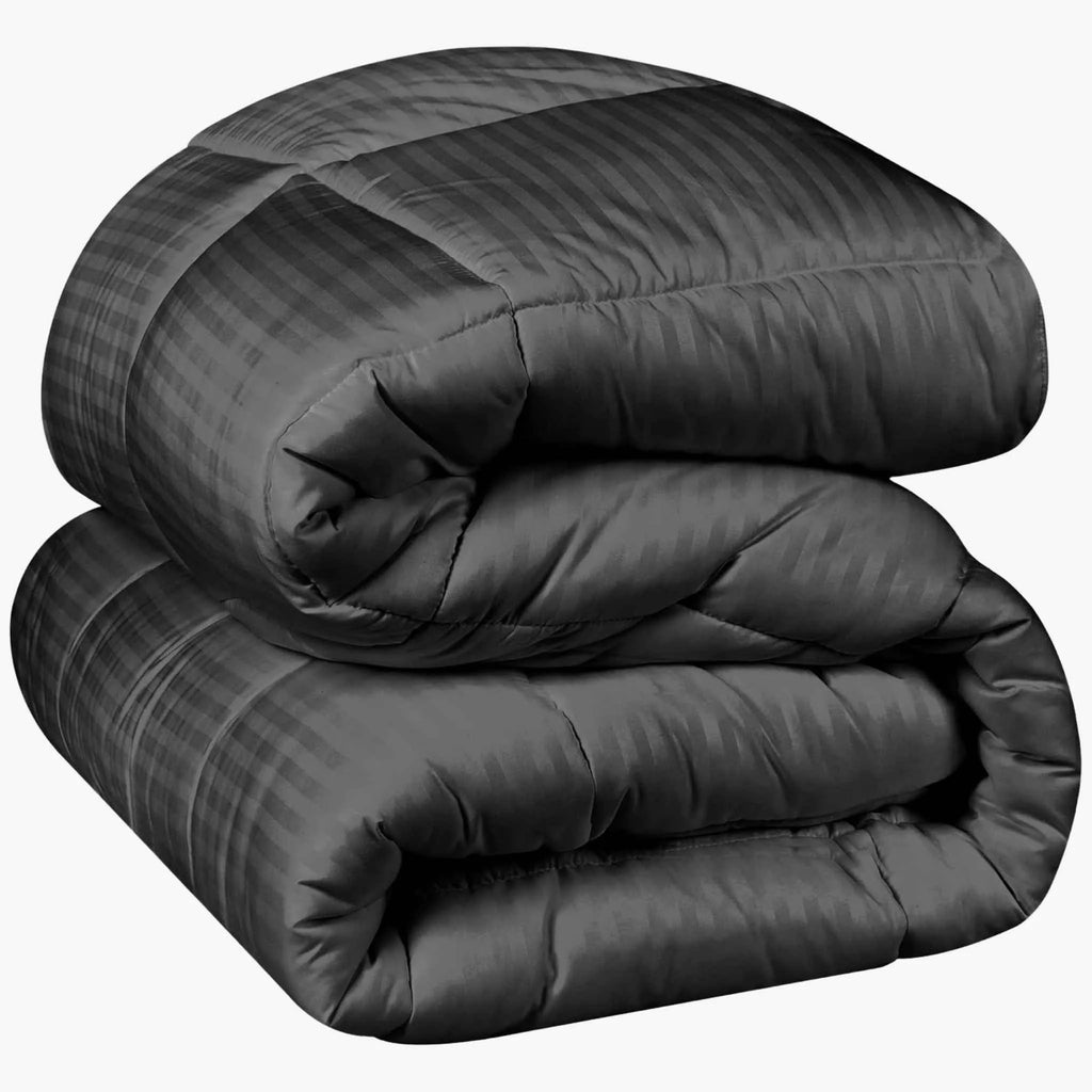 plumon negro acolchado tipo hotel sobre cama moderno elegante